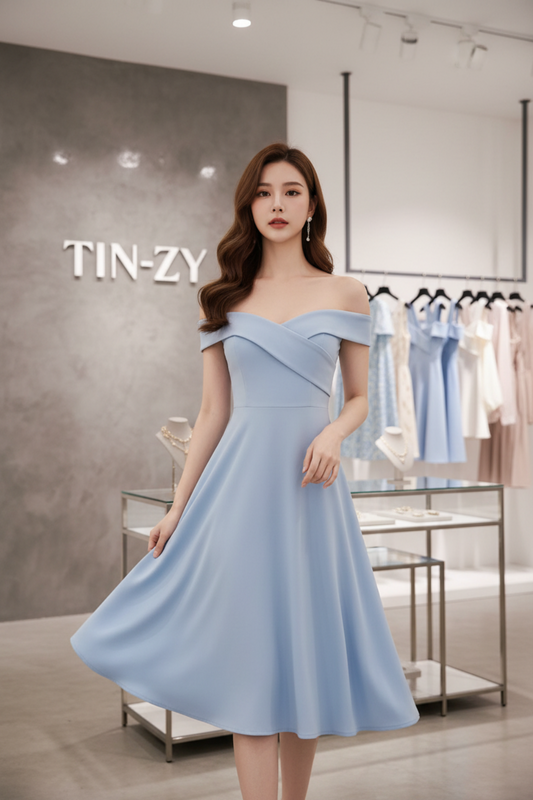 Model wearing wrap dress in TIN-ZY fashion store